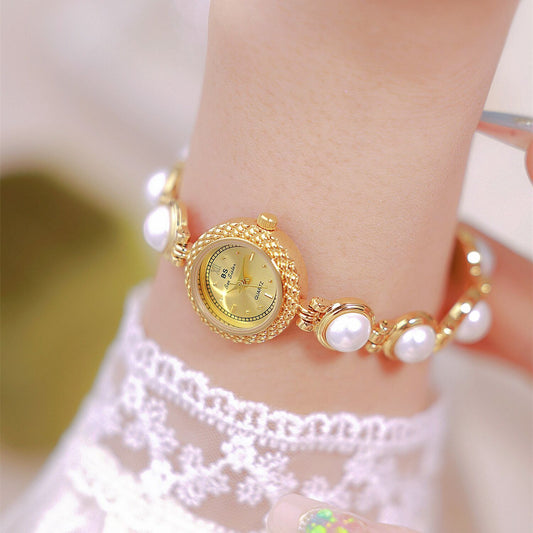 A light luxury pearl bracelet watch for elegant women